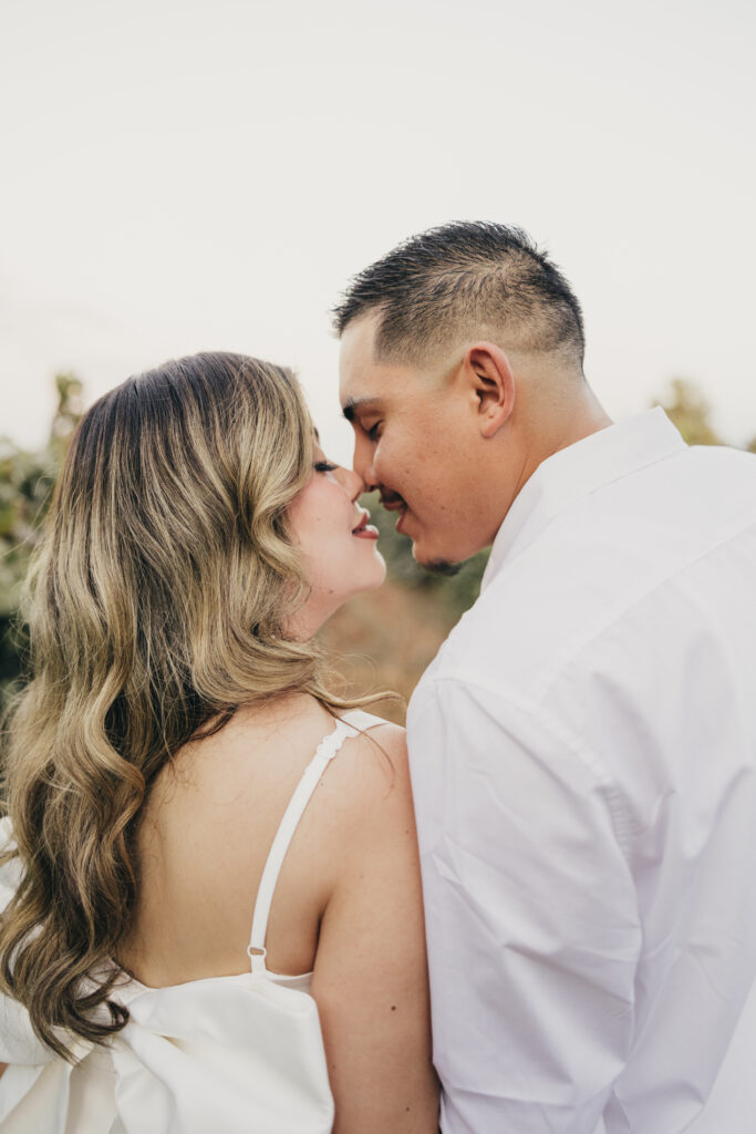 Romantic engagement session moment with couple sharing a kiss outdoors.
Winery Wedding 
Winery engagement session 