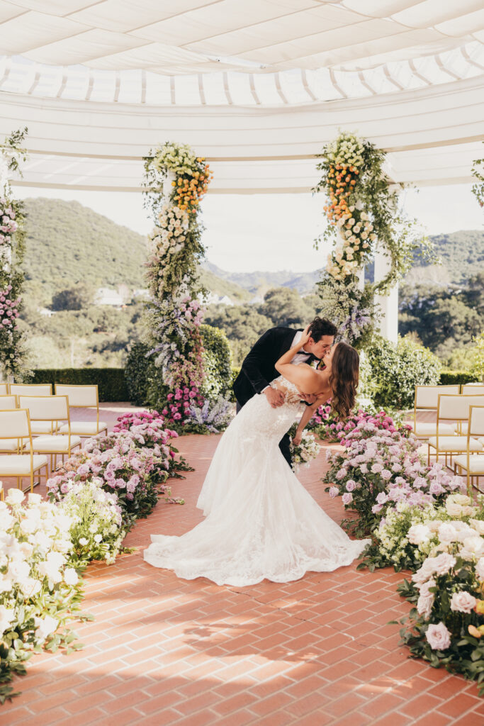 Ceremony arch and florals at Sherwood Country Club wedding editorial
