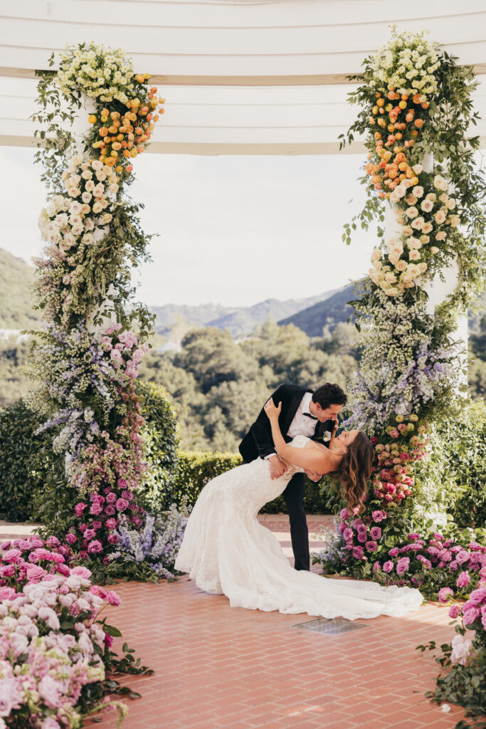 Ceremony arch and florals at Sherwood Country Club wedding editorial
