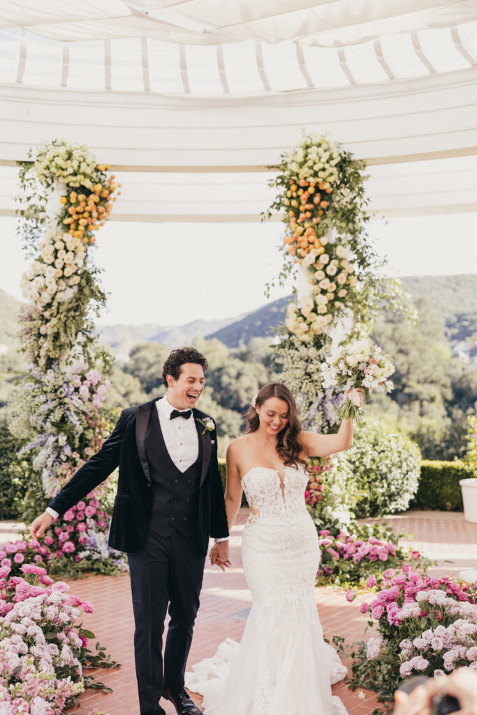 Ceremony arch and florals at Sherwood Country Club wedding editorial
